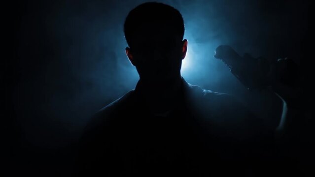 Silhouette shot of a mafia boss or a hitman sitting on a chair with creative lighting cinematic shot of him doing hand movements whilst holding a gun in hand.
