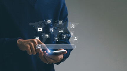 SEO Search Engine Optimization concept. Men use smartphone with SEO icons for promoting ranking...