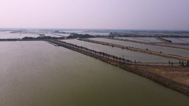 Orbital Panning Shot of Sea Salt Ponds in Thailand.