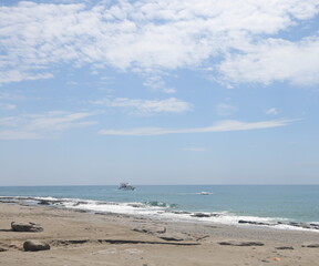 Rocky sea beach on a sunny day in Alanya, Turkiye, May 2023.