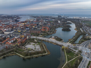 Fototapeta na wymiar Aerial view of polygonal bastions and water filled moat protecting Copenhagen Christiania neighborhood during sunset