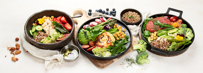 Healthy vegetarian and vegan  salads and Buddha Bowls with vitamins, antioxidants, protein on light  background.
