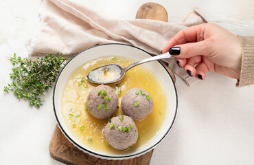 Knodel soup bowl and bread.