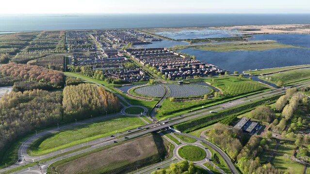 Take a bird's eye view of the Netherlands' commitment to sustainability, as the drone captures the impressive solar panels and eco-friendly suburban development.