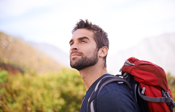 Hiking, relax and thinking with man on mountain for fitness, adventure and travel journey. Backpack, summer and workout with male hiker trekking in nature path for training, freedom and explore