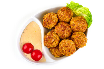 Baked ikea meatballs, isolated on white background.