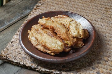 Fried jackfruit bananas on a plate. A portion of traditional food in Southeast Asia.