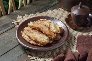 Fried jackfruit bananas on a plate. A portion of traditional food in Southeast Asia.