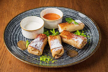 stuffed pancakes with sweet sauce