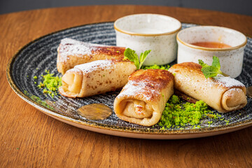 stuffed pancakes with sweet sauce