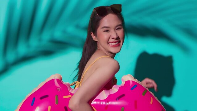 hello summer greeting young asia female woman in swimwear playful joy fun playing face expression hand gesture hold donut shape inflatable, woman ready to have fun in summer time relax casual vacation