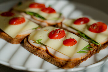 Breakfast. Sandwiches with cheese and tomatoes.