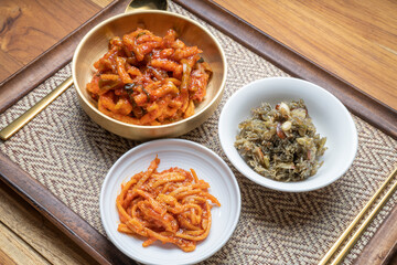 Korean food side dishes, Stir-fried Squid and Vegetables,Stir-fried Anchovies with Nuts and Sesame Leaf with aged Korean soy sauce and rich seasoning Korean traditional food.