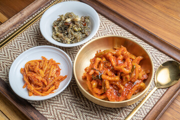 Korean food side dishes, Stir-fried Squid and Vegetables,Stir-fried Anchovies with Nuts and Sesame Leaf with aged Korean soy sauce and rich seasoning Korean traditional food.