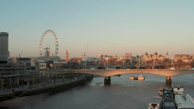 Aerial shot over the thames river by Waterloo bridge looking towards Big Ben