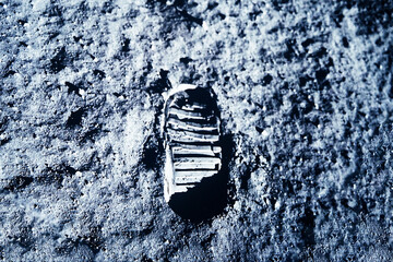 Astronaut footprint on the moon. Elements of this image furnishing NASA.