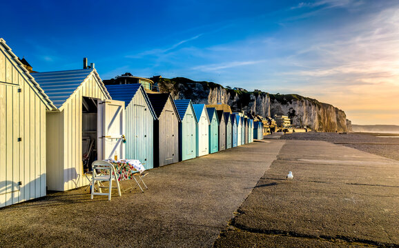 Beach huts during sunset at French coastline, Normandy