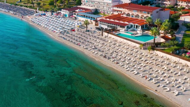 Drone view of beach in Hanioti (Chaniotis or Chanioti) - small, beautiful tourist village by the sea on Kassandra peninsula, Halkidiki (Chalkidiki), Greece