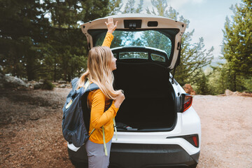 Road trip adventures woman traveling by rental car summer vacations active lifestyle weekend...