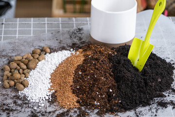 Ingredients for the soil of home potted plants, peat, earth, sand, perlite, vermiculite, coconut. A mixture for planting plants in a pot. Layout - obrazy, fototapety, plakaty