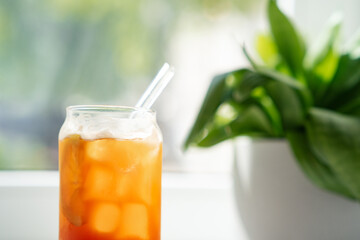 Close up of cold orange lemonade with ice