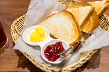 Bread toast with butter and strawberry jam