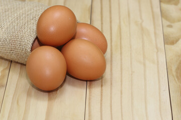 raw eggs on wooden background