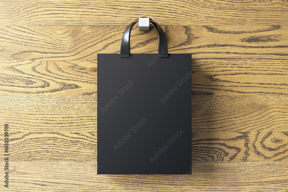 Poster shopping or present concept with front view on blank dark craft bag with silver handles and space fo