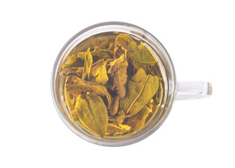 Green tea in a transparent glass cup. View from above. On a white background.