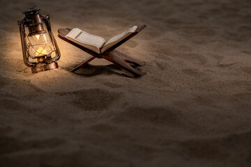 Fototapeta premium Ramadan Kareem with the Holy Quran. The Koran on the beach is cool and peaceful.