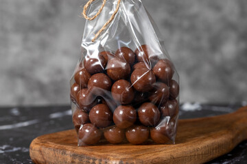 Packed chocolate. Chocolate with hazelnut snack on dark background. Close up