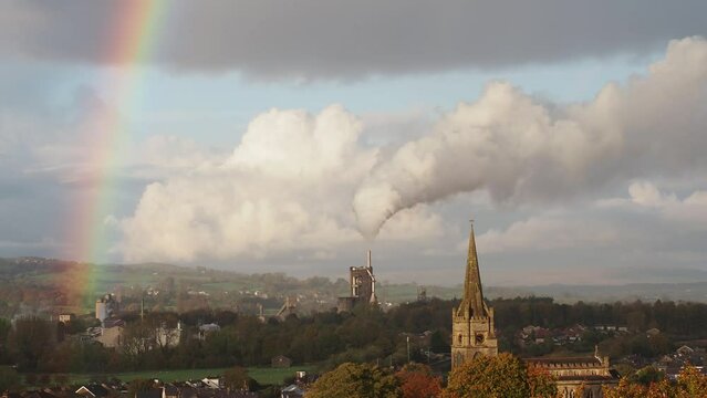 Emissions from cement works and rainbow, Clitheroe, UK