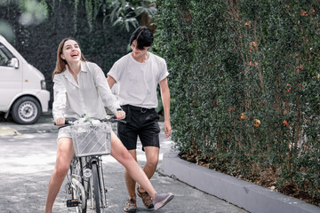 The soon-to-be life partners ride their bikes together. A young adult couple's romantic love, caring, and devotion. Long association and mutual understanding enhance the growth of a close relationship