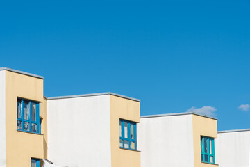 Apartment house with yellow facade and special style in berlin, germany