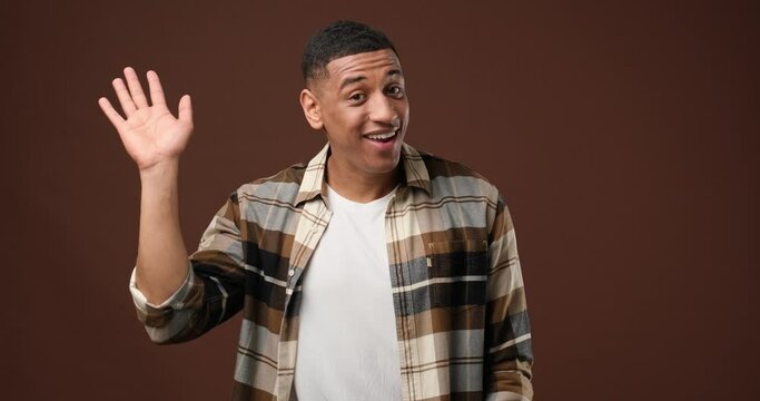 young african american man point index fingers down on something gesture isolated on blue studio background