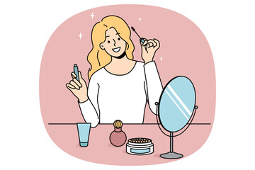 Smiling girl sit at table doing makeup put mascara. Happy young woman look in mirror apply beauty cosmetics products. Daily routine and preparation. Cosmetology. Vector illustration.