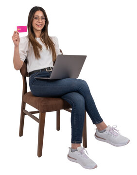 Showing credit card, full body length woman sitting chair and showing credit card. Online shopping concept idea image. Using laptop, recommending  banking, finance, purchase via internet. Copy space.