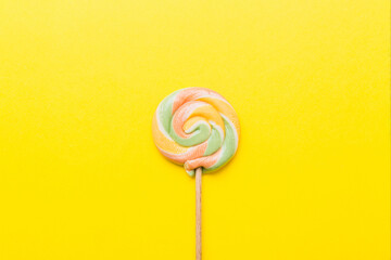 Colorful candies, lollypop on the colorful background, multicolored minimal style top view
