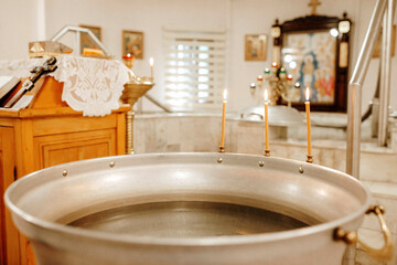 Orthodox Church. The rite of infant baptism. Font.