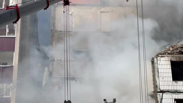 28.04.2023 In Uman, a rocket hit a residential building. The house is completely destroyed. Rescuers clear the rubble. Many victims.