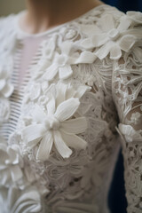 Obraz na płótnie Canvas Exquisite Details of a Delicate Lace Wedding Dress Unveil Timeless Beauty