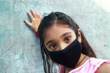 13 years old Asian cute Girl wearing protective mask, prevention of Coronavirus (Covid-19) and...