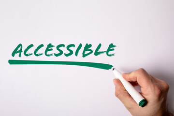 Accessible. Handwriting text with  green marker on a white background