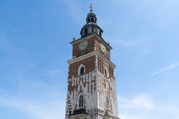 Fototapeta na wymiar Town Hall Tower in Krakow, Poland. Wieża Ratuszowa Kraków on the Main Market Square, in the Old Town district of Cracow.