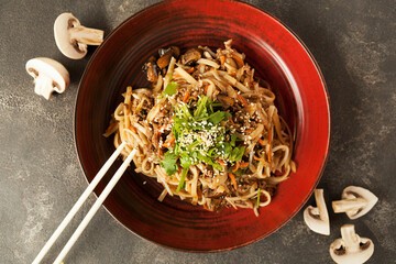 asian noodles with vegetables and mushrooms in sauce, asian cuisine