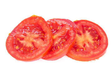 Slice of tomatoes isolated on white background. Top view, flat lay.