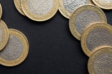 Turkish lira coins on black background. Closeup photo of Turkish coin moneys.