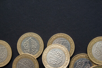 Turkish lira coins on black background. Closeup photo of Turkish coin moneys.