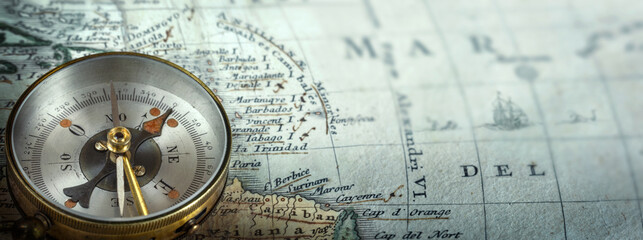 Magnetic old compass on world map. Travel, geography, navigation, tourism and exploration concept...