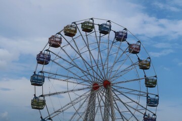 Ferris wheel on a blue sky